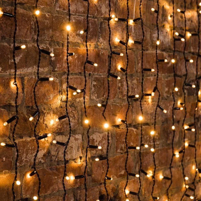 Гирлянда светодиодная "Светодиодный Дождь" 2х3м 600LED тепл. бел. 78Вт 230В IP65 постоян. свечение провод черн. (нужен шнур питания 303-500) Neon-Night 235-146